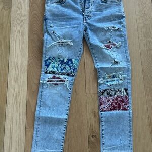 AMIRI Distressed Patchwork Jeans